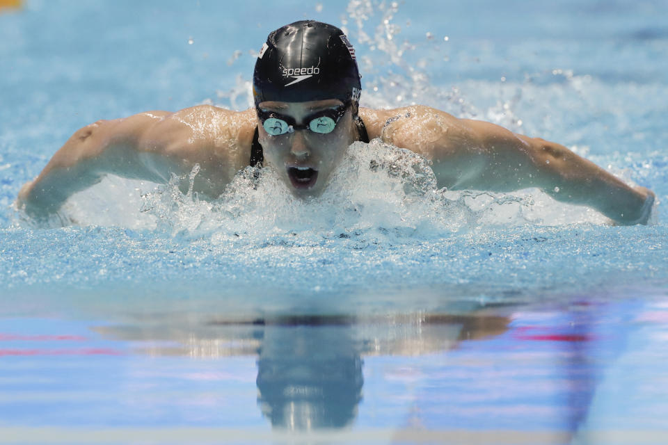 FILE - In this July 24, 2019, file photo, Hali Flickinger swims in the women's 200m butterfly semifinal at the World Swimming Championships in Gwangju, South Korea. With sports still largely on hold because of the coronavirus outbreak, some athletes and coaches have taken advantage of the unexpected free time to try new things, or maybe brush up on an old hobby. For Olympic swimmer Hali Flickinger, it's gardening and home renovations. (AP Photo/Lee Jin-man, File)