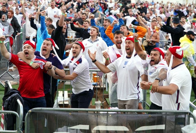 Fans in Manchester celebrate Harry Kane's opening goal against Ukraine