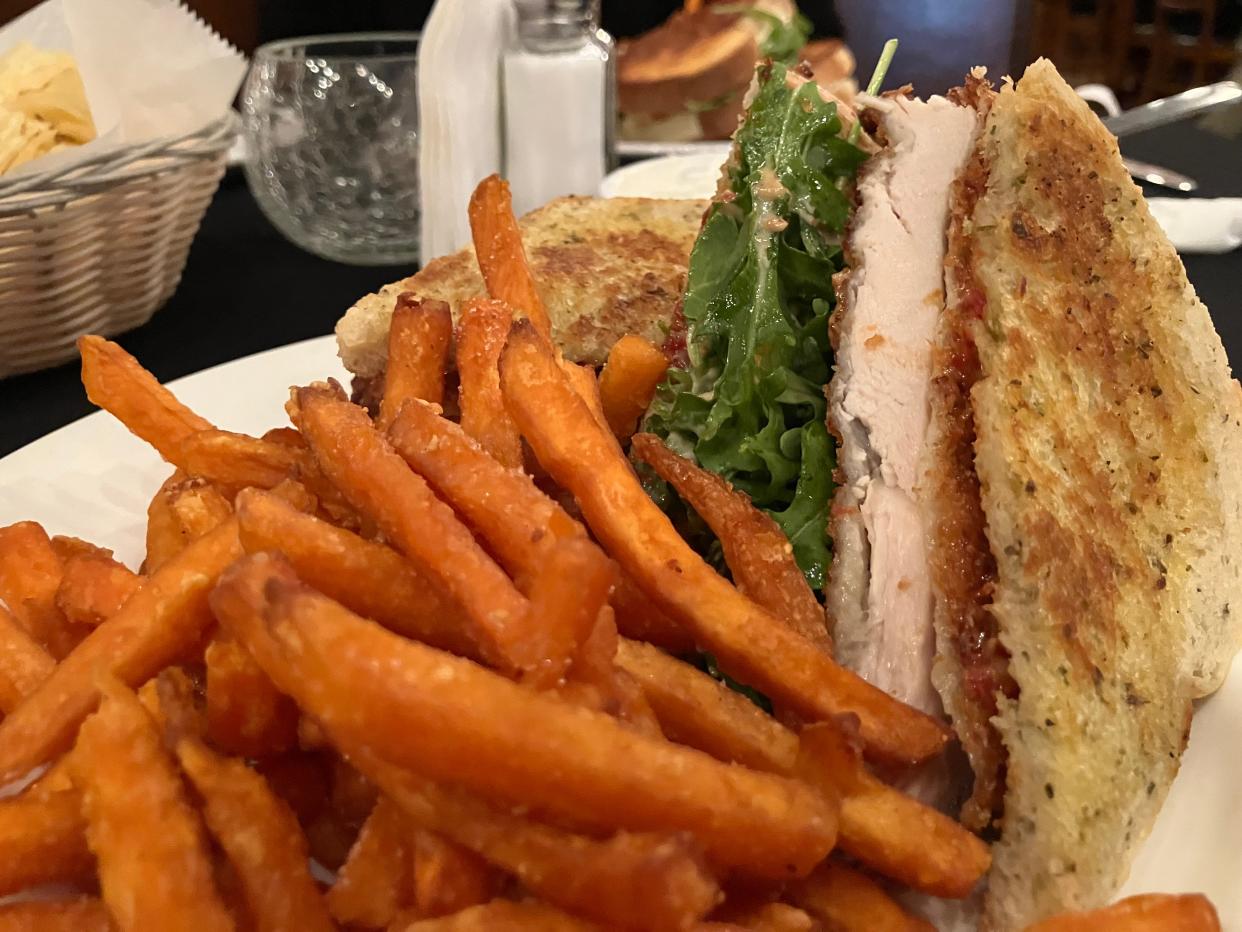 The restaurant's panko crusted chicken sandwich is comprised of a hand-breaded chicken breast topped with arugula and sun-dried tomato aioli on Tuscan herb bread.