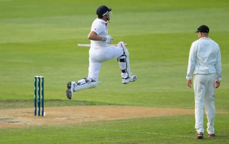 England's Nick Compton celebrates his maiden Test century, against New Zealand, in Dunedin, on March 9, 2013. Compton had a scare on 16 when New Zealand appealed for a catch down the leg-side but both the appeal and review were turned down