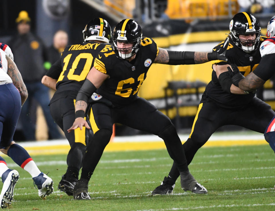 Dec 7, 2023; Pittsburgh, Pennsylvania, USA; Pittsburgh Steelers center Mason Cole (61) blocks for quarterback Mitch Trubisky (10) against the New England Patriots during the first quarter at Acrisure Stadium. Mandatory Credit: Philip G. Pavely-USA TODAY Sports