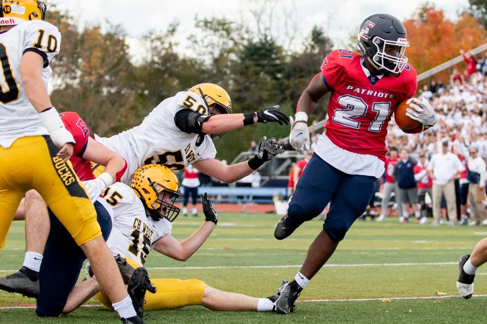 Central Bucks East running back Ethan Shine runs the ball in for a 1-yard touchdown against Central Bucks West, on Saturday, October 30, 2021, at Patriot Stadium in Buckingham. The Bucks defeated the Patriots 35-15.