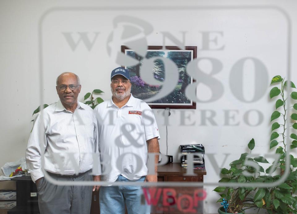 WRNE owner Robert Hill, left, and WBQP owner Vernon Watson at the WRNE radio and WBQP television station offices in Pensacola on Wednesday, Oct. 4, 2023.