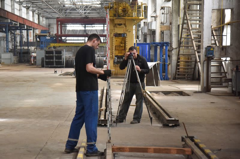 Employees prepare a facility for producing fire trucks, as the factory was relocated from Chernihiv region to Lviv amid Russia's invasion