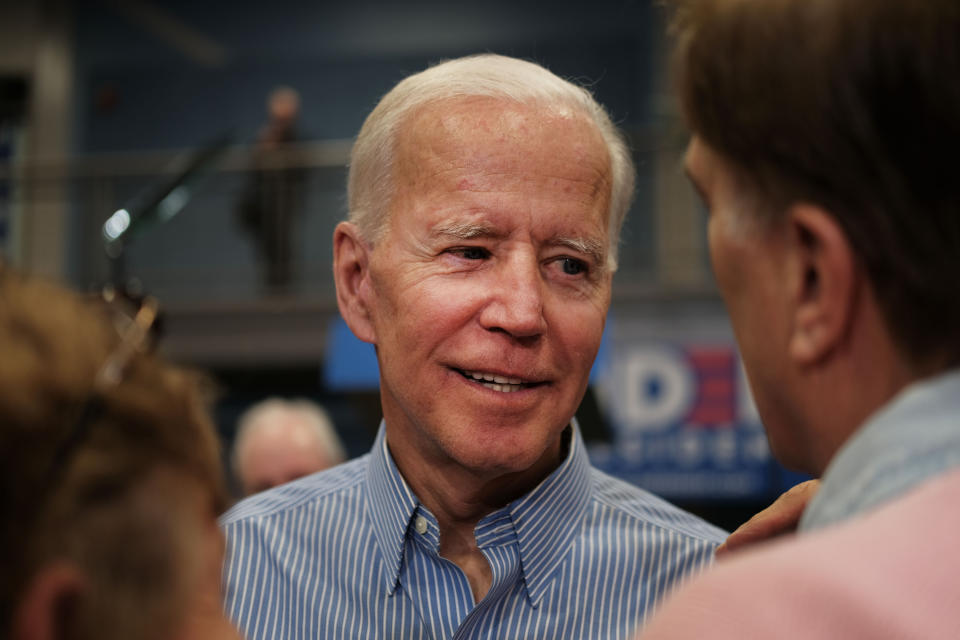 Former Vice President Joe Biden (D) greets voters in Manchester, New Hampshire, on Monday night. (Spencer Platt/Getty Images)