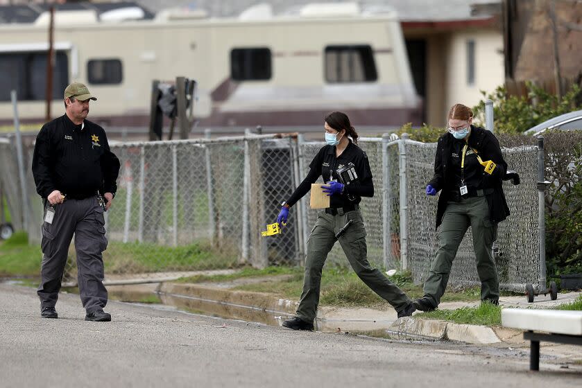 GOSHEN, CA - JANUARY 16: Tulare County Sheriff crime unit investigates the scene where six people, including a 6-month old baby, her teenage mother and an elderly woman, were killed in a Central Valley farming community in what the local sheriff said was likely a targeted attack by a drug cartel on Monday, Jan. 16, 2023 in Goshen, CA. The massacre occurred around 3:30 a.m. in and around a residence in the Tulare County town of Goshen near Visalia. (Gary Coronado / Los Angeles Times)