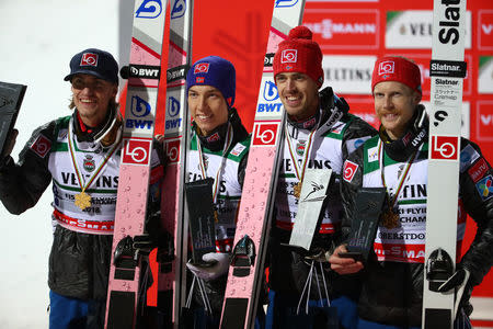 Ski Jumping - Ski Flying World Championships - team final round - Oberstdorf, Germany - January 21, 2018. Gold medalists Daniel Andre Tande, Johann Andre Forfang, Andreas Stjernen and Robert Johansson of team Norway celebrate on the podium. REUTERS/Michael Dalder