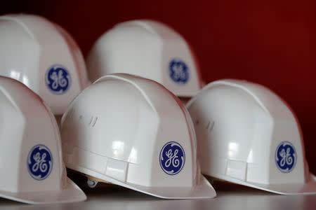 FILE PHOTO: The General Electric logo is pictured on working helmets during a visit at the General Electric offshore wind turbine plant in Montoir-de-Bretagne, near Saint-Nazaire, western France, November 21, 2016. REUTERS/Stephane Mahe/File Photo