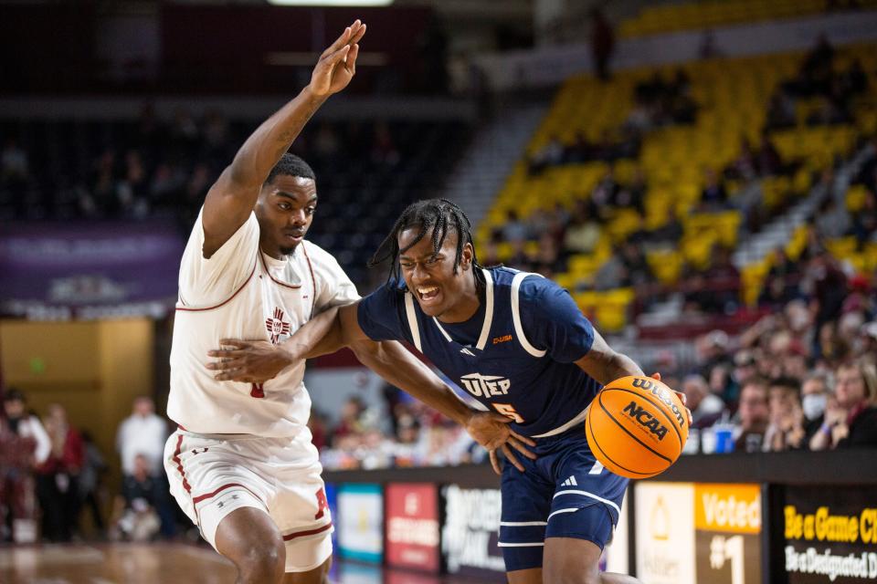 UTEP guard David Terrell Jr. pushes past NMSU guard Jaylin Jackson-Posey during a college basketball game on Thursday, Jan. 4, 2024, at Pan American Center.