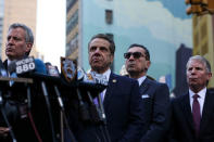 New York State Governor Andrew Cuomo stands after he spoke to the press near the Port Authority Bus Terminal after reports of an explosion in Manhattan, New York, U.S., December 11, 2017. REUTERS/Amr Alfiky