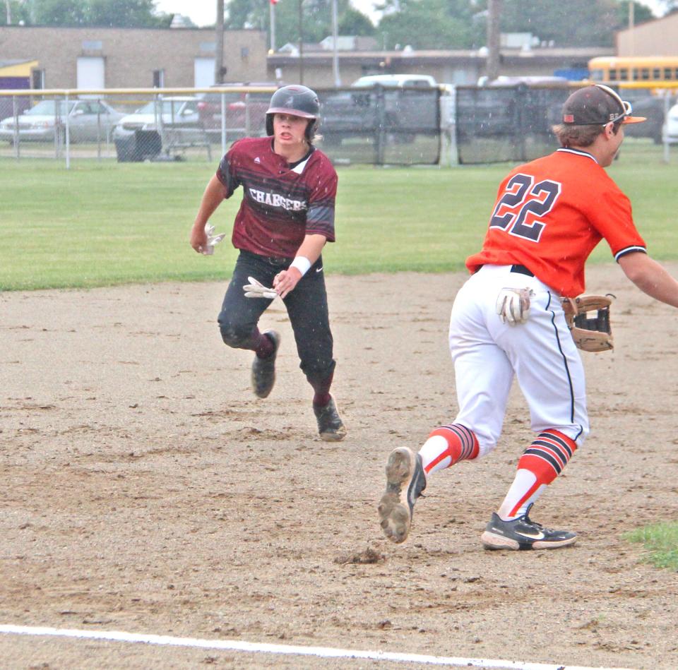Union City senior Wade Hoffman hustles his way to third base during the D3 regional semifinals