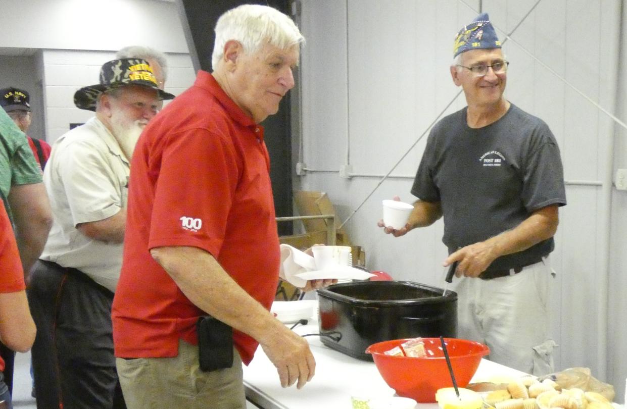 Bernie Kessler of American Legion Post 181, right, serves bean soup to veterans on during the 2022 Crawford County Fair. The annual meal, served in the Youth Building, is free to all veterans. Others are welcome to dine, but are asked to make a donation.