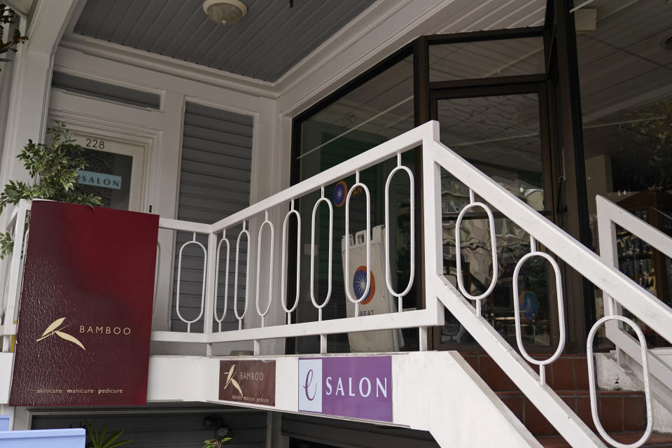 A stairway leads to the entrance of eSalon at top left on Union Street Wednesday, Sept. 2, 2020, in San Francisco. House Speaker Nancy Pelosi is getting heat over a solo hair salon visit in San Francisco on Monday at a time when California businesses are limited by concern over coronavirus. But Pelosi's spokesman said she was complying with the rules as presented to her by eSalon. (AP Photo/Eric Risberg)