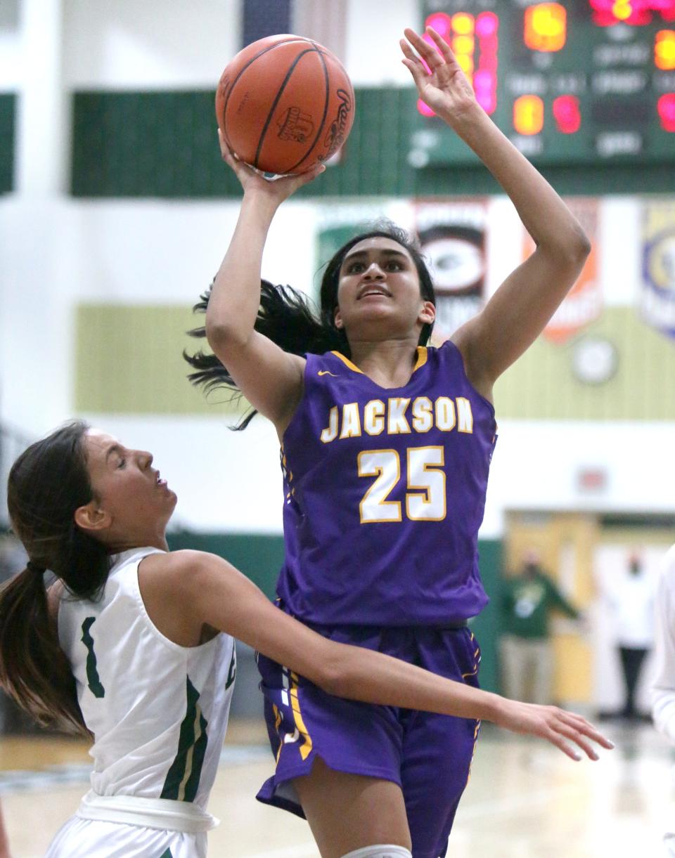 Leena Patibandla (25) of Jackson takes a shot while being guarded by Meya Metz (1) of GlenOak during their game at GlenOak on Friday, Dec. 11, 2020. 