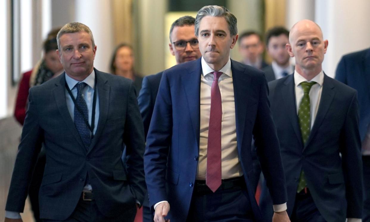 <span>Simon Harris (centre) has asked his justice minister to bring proposals to cabinet next week.</span><span>Photograph: Brian Lawless/PA Media</span>