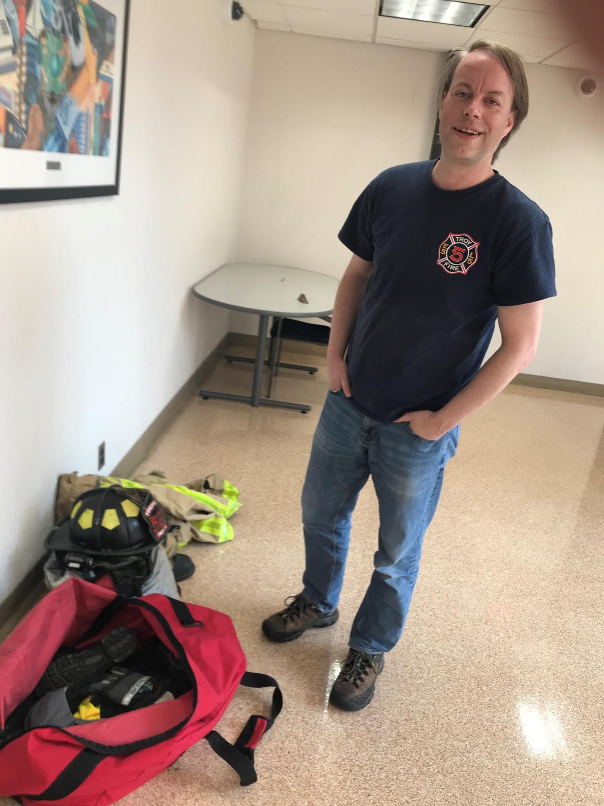 Troy resident and city council candidate Ed Ross flashes a smile on May 6, 2024 at Troy City Hall, after turning in his firefighting gear. That followed Ross's termination by the fire chief from his volunteer firefighting position because he's running for office.
