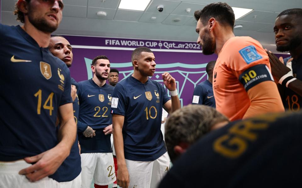 Kylian Mbappe of France speaks to team mate Hugo Lloris at half time - GETTY IMAGES