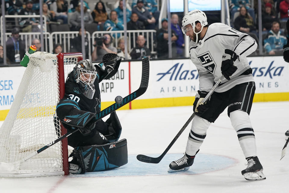 San Jose Sharks goaltender Aaron Dell (30) blocks a shot by Los Angeles Kings center Michael Amadio (10) during the second period of an NHL hockey game in San Jose, Calif., Friday, Dec. 27, 2019. (AP Photo/Tony Avelar)