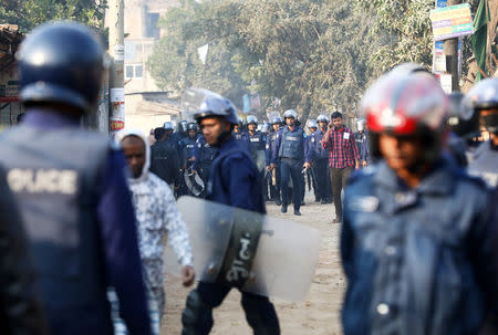 Policemen are seen patrolling the street while garments workers are protesting for higher wages at Ashulia, outskirt of Dhaka, Bangladesh, January 14, 2019. REUTERS/Mohammad Ponir Hossain