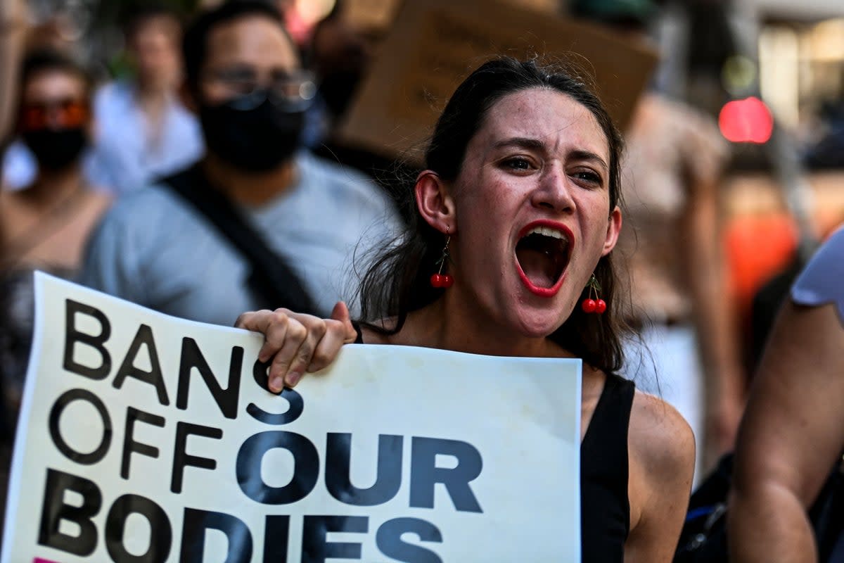 Abortion rights activists rally after the US Supreme Court striked down the right to abortion, in Miami, Florida, in June 2022 (AFP via Getty Images)