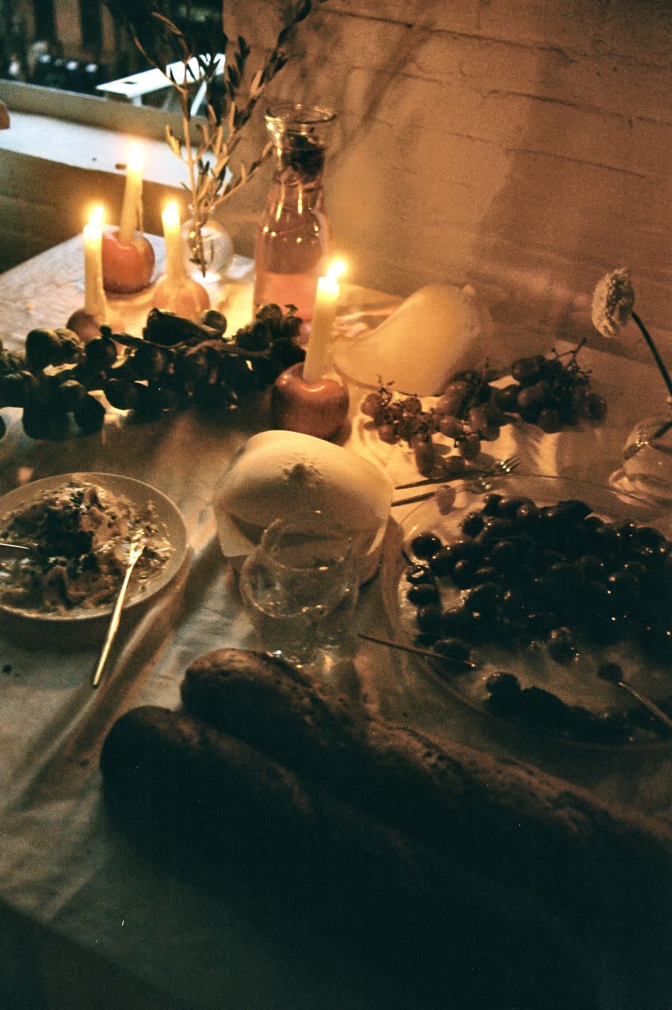 a table with candles and food