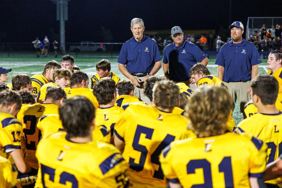 Littlestown coach Mike Lippy speaks to his players after Littlestown won a football game against the Hanover Nighthawks, Saturday, Sept. 17, 2022, in Littlestown Borough. Littlestown defeated Hanover 50-6.