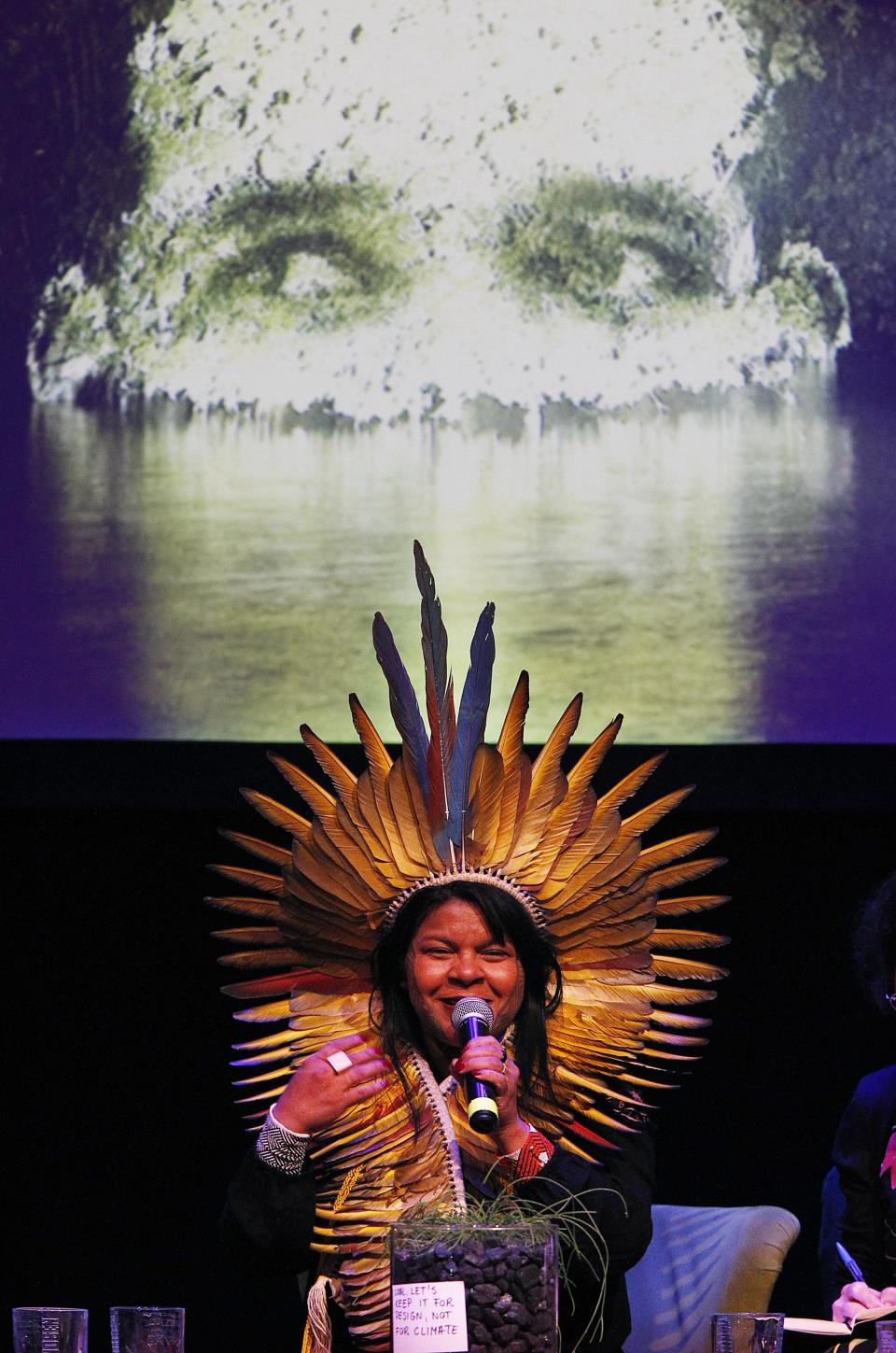 A Brazilian indigenous woman speaks during a side event outside of the COP24 UN Climate Change Conference 2018 in Katowice, Poland, Wednesday, Dec. 12, 2018.(AP Photo/Czarek Sokolowski)