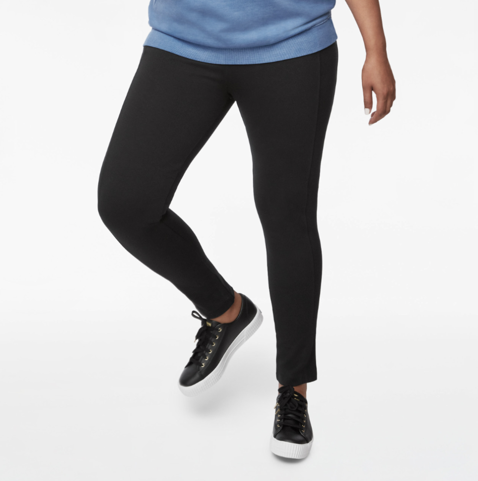 woman wearing blue sweater, black sneakers, and black Everyday Active Seamed Legging (Photo via Northern Reflections)