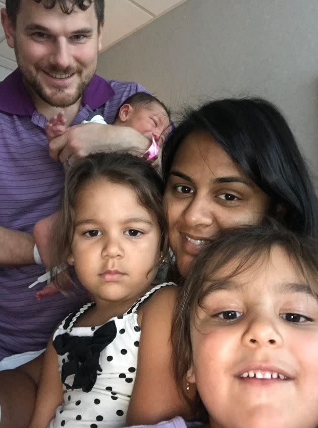 The author, her spouse, their two daughters, and newborn son posing at the hospital for their first family selfie after she gave birth. (Photo: Courtesy of Krystal A. Sital)