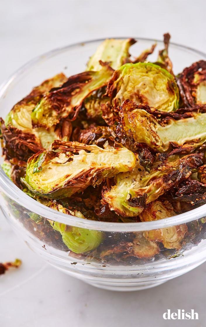 <p>Not only are are <a href="https://www.delish.com/cooking/g1409/brussels-sprouts-recipes/" rel="nofollow noopener" target="_blank" data-ylk="slk:Brussels" class="link ">Brussels</a> our favorite veggie side, they're now our favorite salty, crunchy snack! We love this garlic-Parm variety dipped in <a href="https://www.delish.com/cooking/recipe-ideas/a19695267/best-caesar-salad-recipe/" rel="nofollow noopener" target="_blank" data-ylk="slk:Caesar" class="link ">Caesar</a> dressing, but <a href="https://www.delish.com/cooking/recipe-ideas/a25634518/ranch-dressing-recipe/" rel="nofollow noopener" target="_blank" data-ylk="slk:ranch" class="link ">ranch</a> wouldn't be a bad idea either.</p><p>Get the <strong><a href="https://www.delish.com/cooking/recipe-ideas/a19673558/best-brussels-sprout-chips-recipe/" rel="nofollow noopener" target="_blank" data-ylk="slk:Air Fryer Brussels Sprouts Chips recipe" class="link ">Air Fryer Brussels Sprouts Chips recipe</a></strong>.</p>