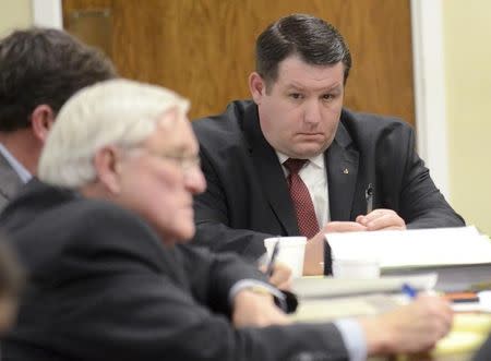 Former Eutawville Police Chief Richard Combs sits with lawyers on the second day of testimony in his trial for the murder of Bernard Bailey in Orangeburg, South Carolina January 8, 2015. REUTERS/The Times and Democrat/Larry Hardy/Pool