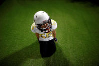 <p>An Eagles player rests before a game against the Sharklets in the Future League American football youth league in Beijing, May 26, 2017. (Photo: Thomas Peter/Reuters) </p>