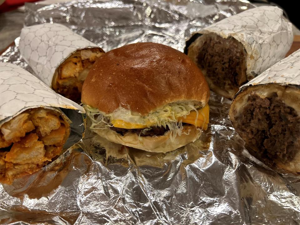 A Buffalo chicken wrap, Mack-Daddy burger and cheesesteak from Ocean Acres Convenience Store in Stafford.