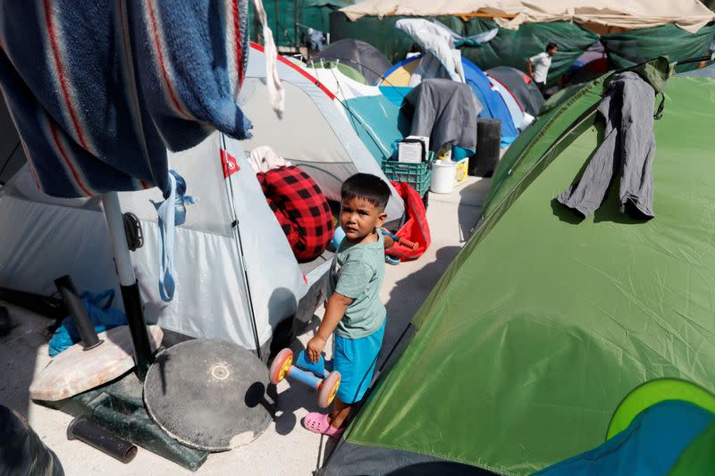 A child from the destroyed Moria camp for refugees and migrants is seen in the Community Center managed by Team Humanity