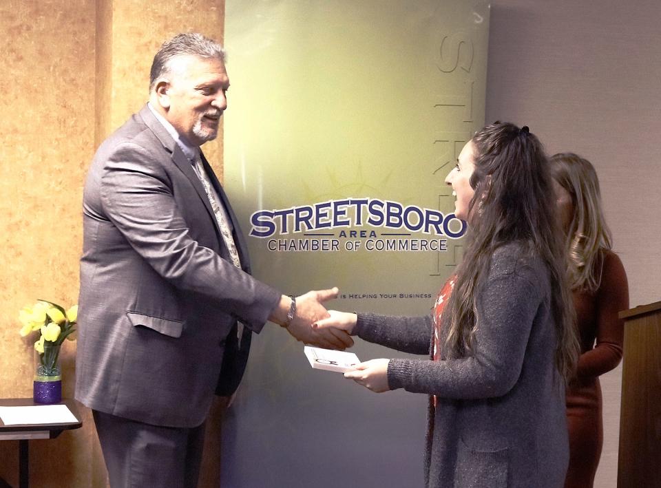 Andrea Sutton, a board member of the Streetsboro Area Chamber of Commerce, is congratulated by Mayor Glenn Broska on winning the NOACC Bright Star Award, given annually to someone who has gone above and beyond in their support of the chamber.