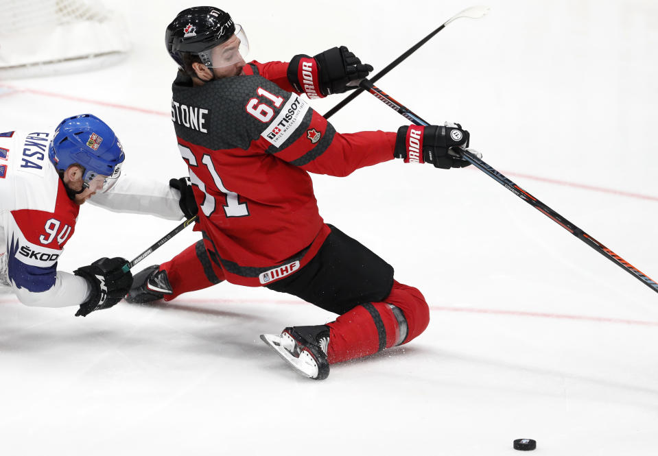 Czech Republic's Radek Faksa, left, challenges Canada's Mark Stone during the Ice Hockey World Championships semifinal match between Canada and Czech Republic at the Ondrej Nepela Arena in Bratislava, Slovakia, Saturday, May 25, 2019. (AP Photo/Petr David Josek)