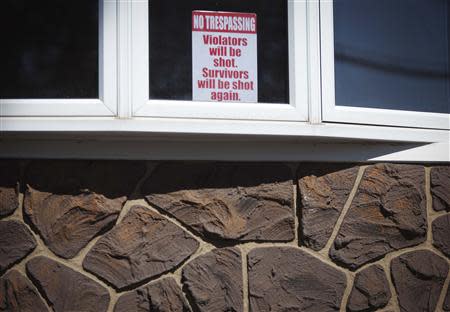 A sign is pictured on the window of a house in the New Dorp Beach area in the Staten Island borough of New York, September 20, 2013. REUTERS/Carlo Allegri