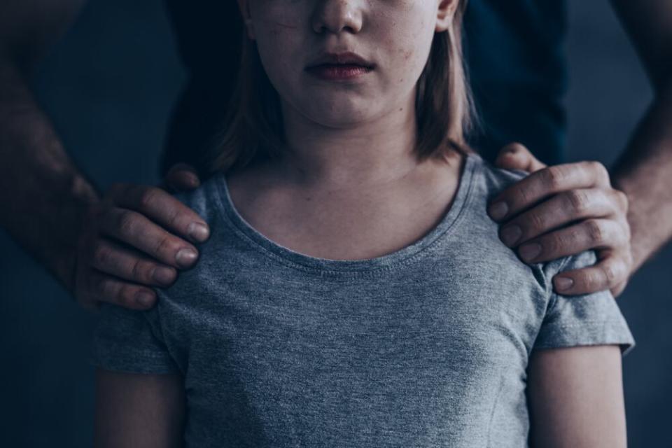 This social media campaign photo symbolizes an abused girl or child.