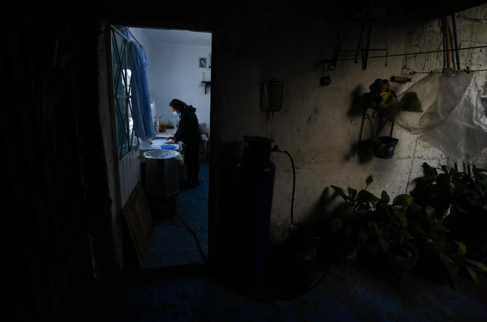 Araceli Samperio prepares tamales she sells from her home in a popular neighborhood of Mexico City, Wednesday, Jan. 25, 2023. Vendors also are known to slowly pedal big tricycles down streets offering tamales, which can also be wrapped in banana leaves or other foliage. (AP Photo/Fernando Llano)