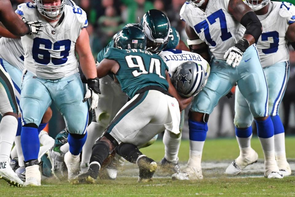 Nov 5, 2023; Philadelphia, Pennsylvania, USA; Philadelphia Eagles defensive end Brandon Graham (55) and Philadelphia Eagles defensive end Josh Sweat (94) sack Dallas Cowboys quarterback Dak Prescott (4) during the fourth quarter at Lincoln Financial Field. Mandatory Credit: Eric Hartline-USA TODAY Sports