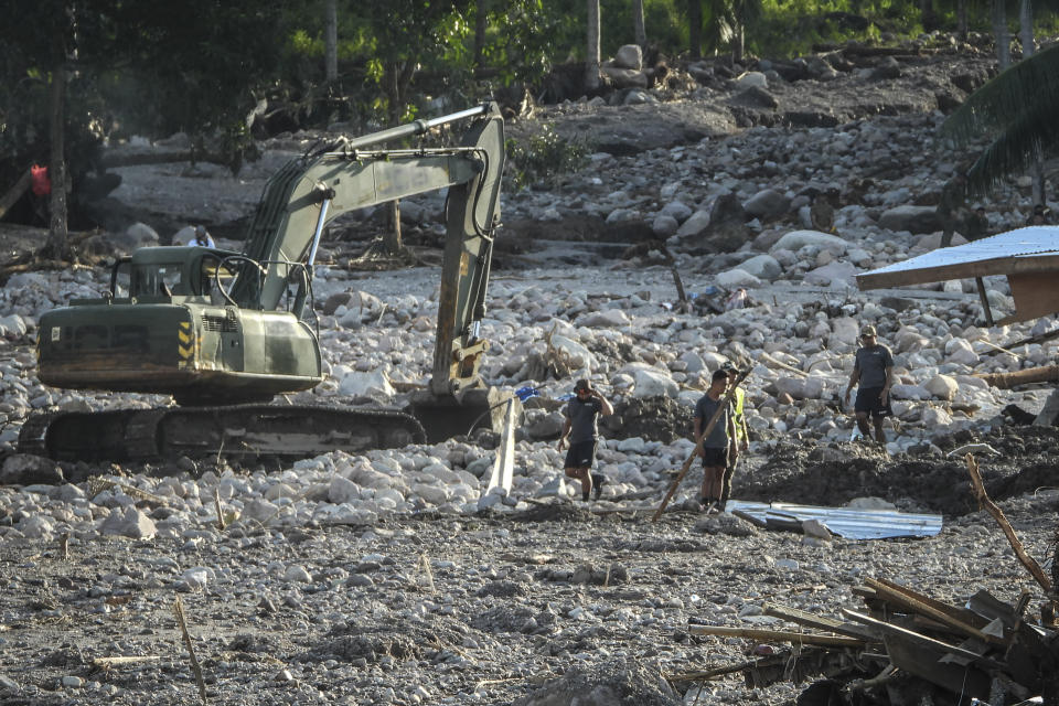 Rescuers continue to search for missing bodies in a mudslide after Tropical Storm Nalgae hit Barangay Kusiong, Datu Odin Sinsuat, Maguindanao province, southern Philippines, Monday Oct. 31, 2022. Philippine officials say more than 100 people have died in one of the most destructive storms to lash the Philippines this year. (AP Photo)