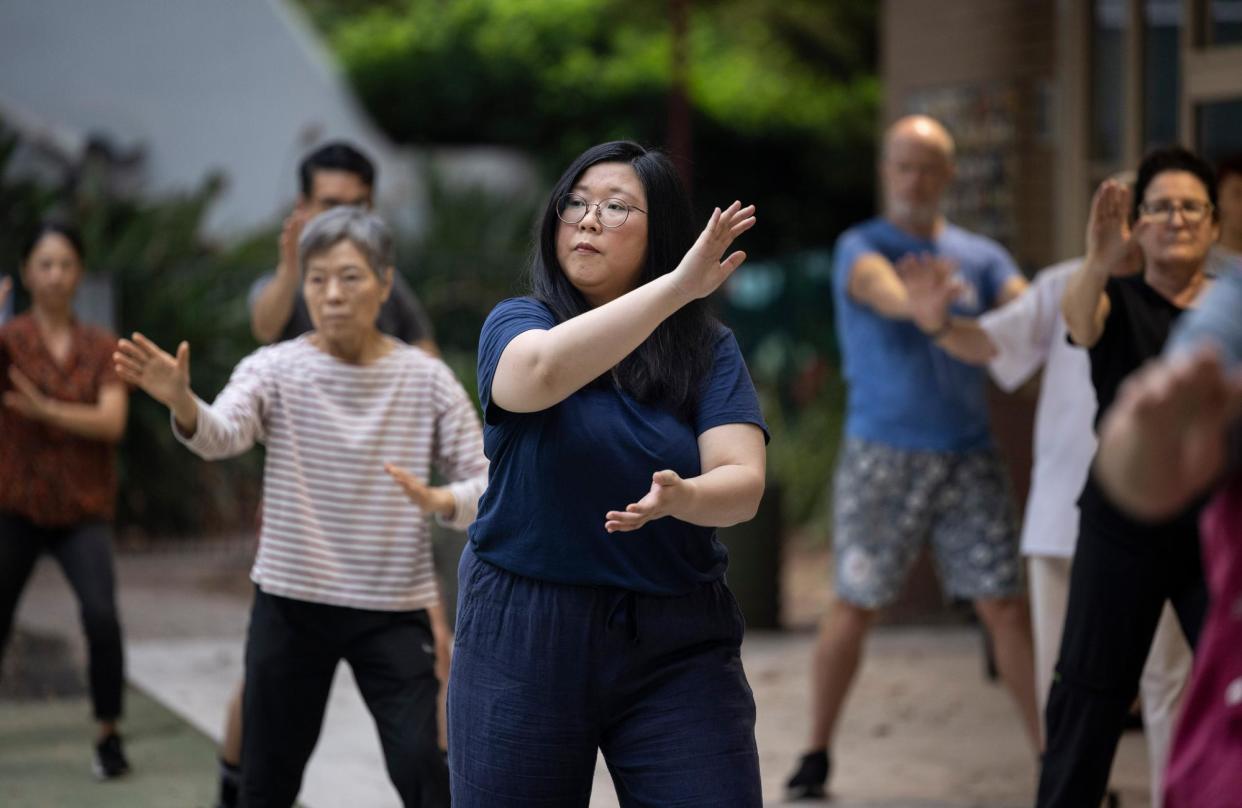 <span>‘Our gentle, low-impact movements only ever take us a step or two away from our starting positions’: Jennifer Wong at her first tai chi class.</span><span>Photograph: Jessica Hromas/The Guardian</span>