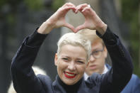 FILE - In this Thursday, Aug. 27, 2020 file photo, Maria Kolesnikova, one of Belarus' opposition leaders, gestures on the way to the Belarusian Investigative Committee in Minsk, Belarus. Maria Kolesnikova, a leading opposition activist and several other members of an opposition council in Belarus went missing Monday and their colleagues feared they were detained as part of the authorities' efforts to squelch nearly a month of protests against the re-election of the country's authoritarian leader. (AP Photo/Dmitri Lovetsky, File)