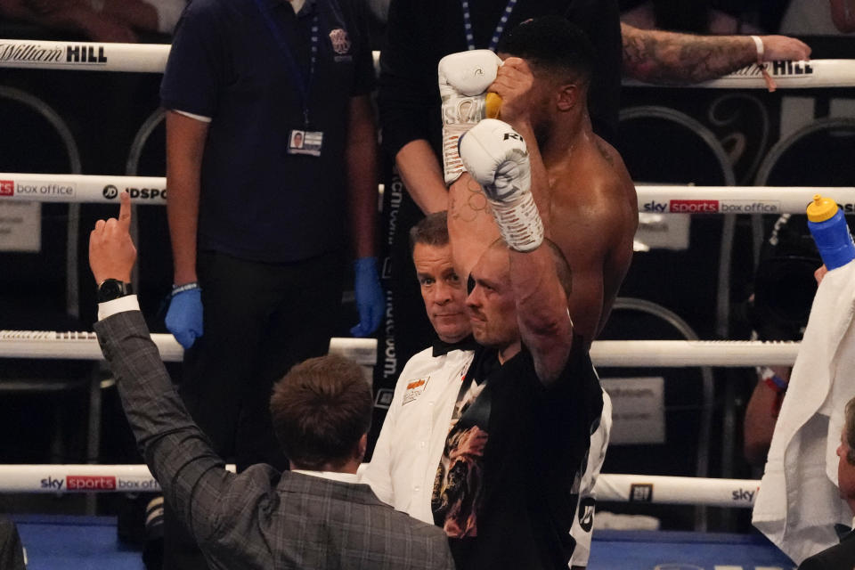 Oleksandr Usyk of Ukraine celebrates after his unanimous decision victory over Anthony Joshua of Britain in their WBA (Super), WBO and IBF boxing title bout at the Tottenham Hotspur Stadium in London, Saturday, Sept. 25, 2021. (AP Photo/Frank Augstein)