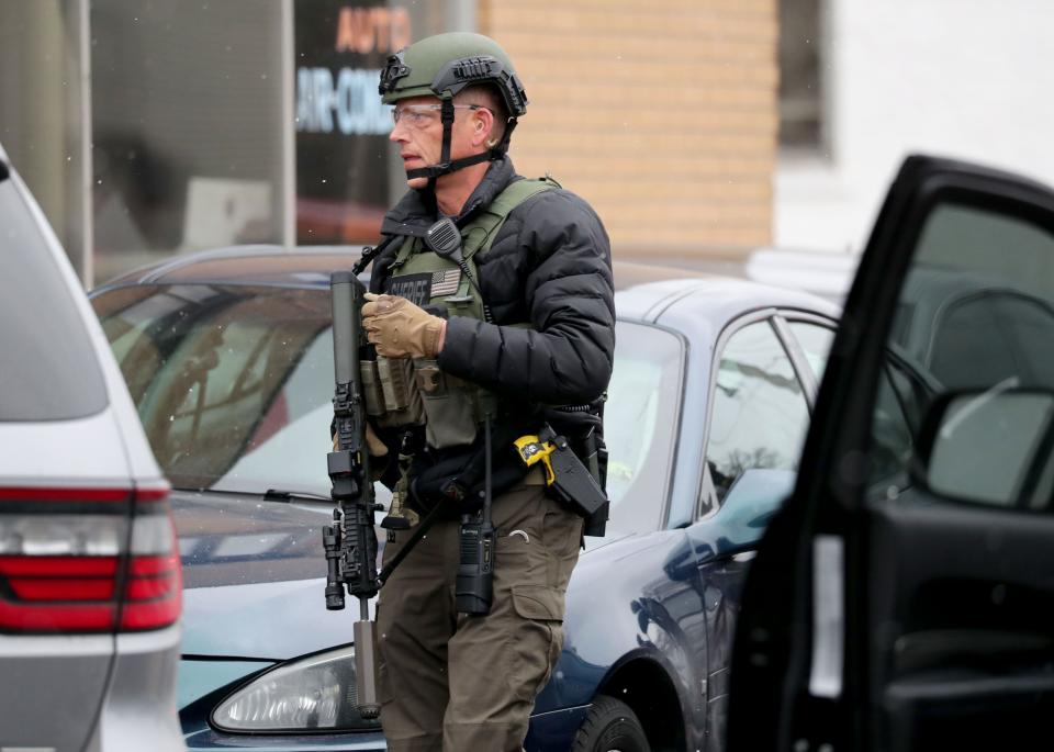 Police and emergency officials work on the scene of an active shooter on West State and North 35th streets near Molson Coors in Milwaukee. Molson Coors said Wednesday there was an active shooter on its Milwaukee campus and ordered its employees to find a safe place to hide.