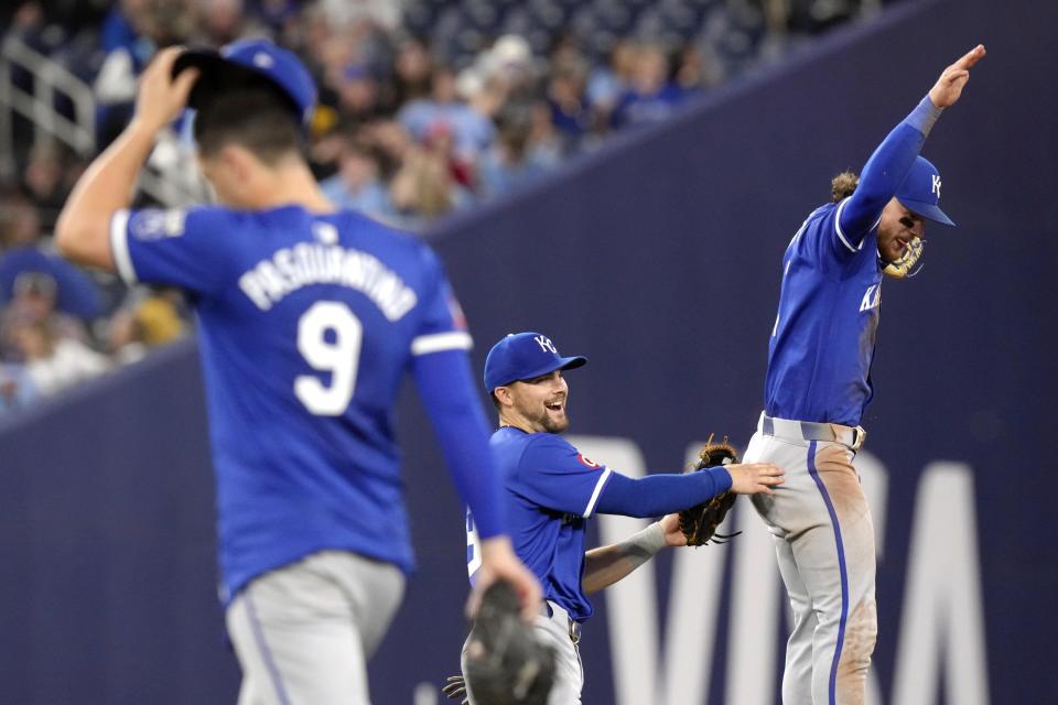 Kansas City Royals second baseman Michael Massey, center, celebrates with Bobby Witt Jr. after the Royals' win over the Toronto Blue Jays in a baseball game in Toronto, Wednesday, May 1, 2024. (Chris Young/The Canadian Press via AP)