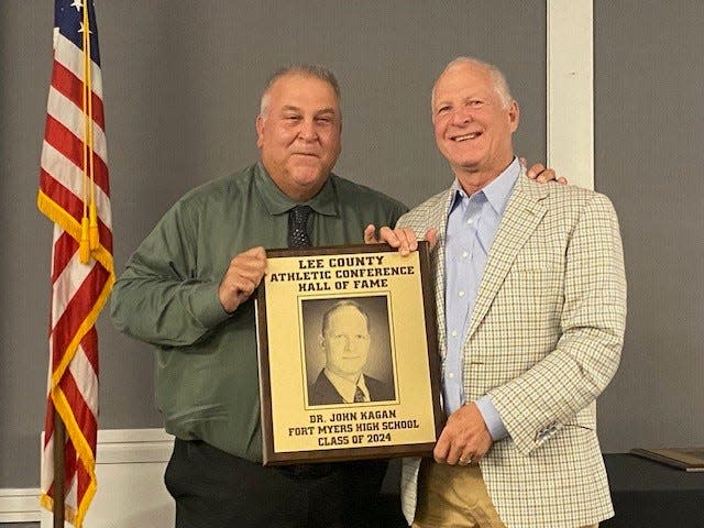 Dr. John Kagan, who served as the team physician for Fort Myers High School from 1981-2023, was among eight members of the Lee County Athletic Conference Hall of Fame's Class of 2024. With him is Green Wave head football coach Sam Sirianni Jr.