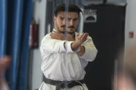 Spanish karate athlete Damian Quinteros is reflected in a large mirror as he trains in Madrid, Spain, Friday, Feb. 7, 2020. More than five years ago, one of Spain's most successful karate athletes was splitting his time between practice, school and his day job as an aeronautical engineer. Now, nearly five months before the Tokyo Games, Quintero is a full-time karateka and a top contender for the gold medal in Japan. (AP Photo/Paul White)