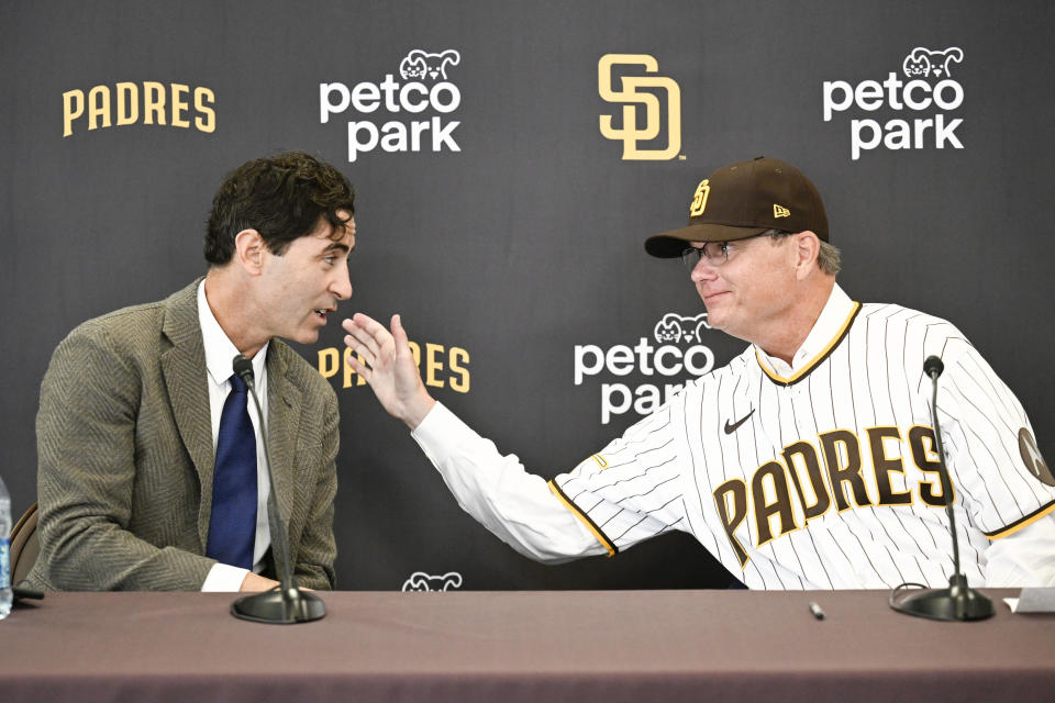 San Diego Padres general manager A.J. Preller, left, and San Diego Padres new manager Mike Shildt talk during a news conference to announce Shildt's hiring, Tuesday, Nov. 21, 2023, in San Diego. (AP Photo/Denis Poroy)