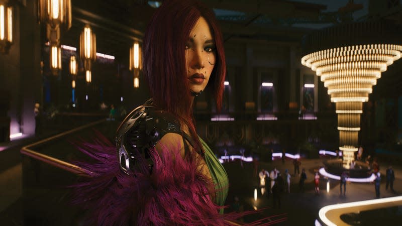 A woman stands at the counter in a futuristic bar. 